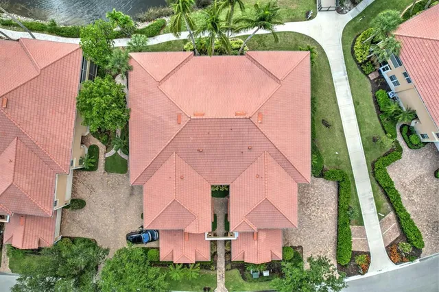 a swimming pool view with a seating space