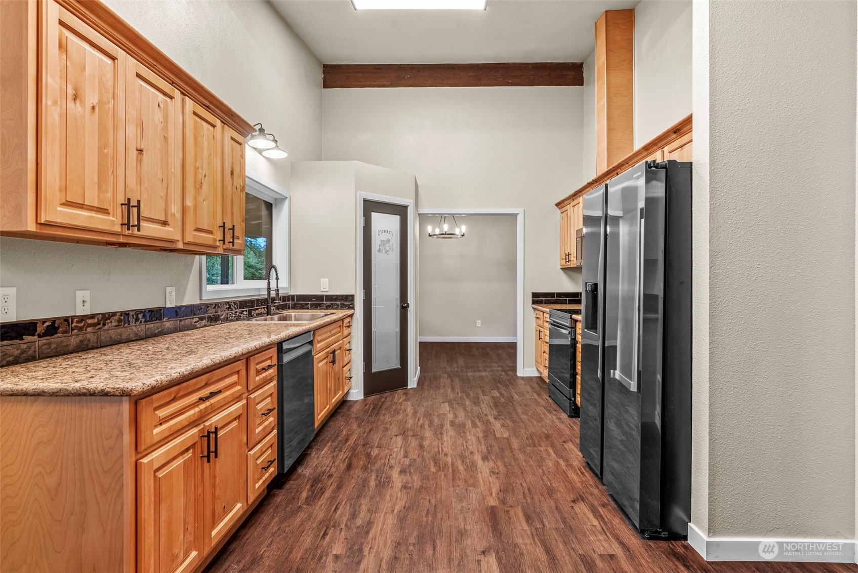 122 Fircrest Road Chehalis, WA 98532 - Photo 11 of 31 a kitchen with stainless steel appliances granite countertop a refrigerator a stove and a wooden floors