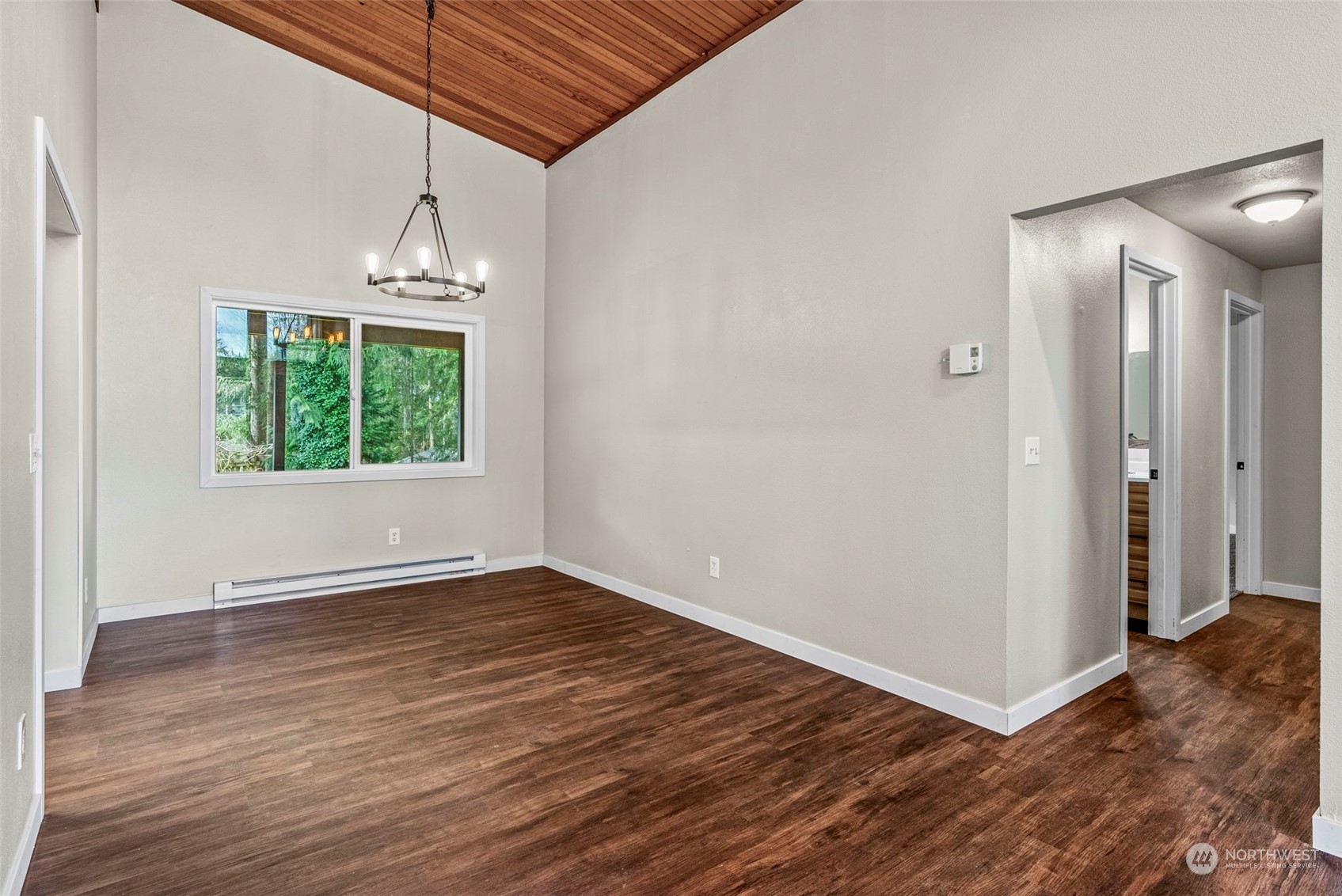 122 Fircrest Road Chehalis, WA 98532 - Photo 14 of 31 an empty room with wooden floor mirror and windows