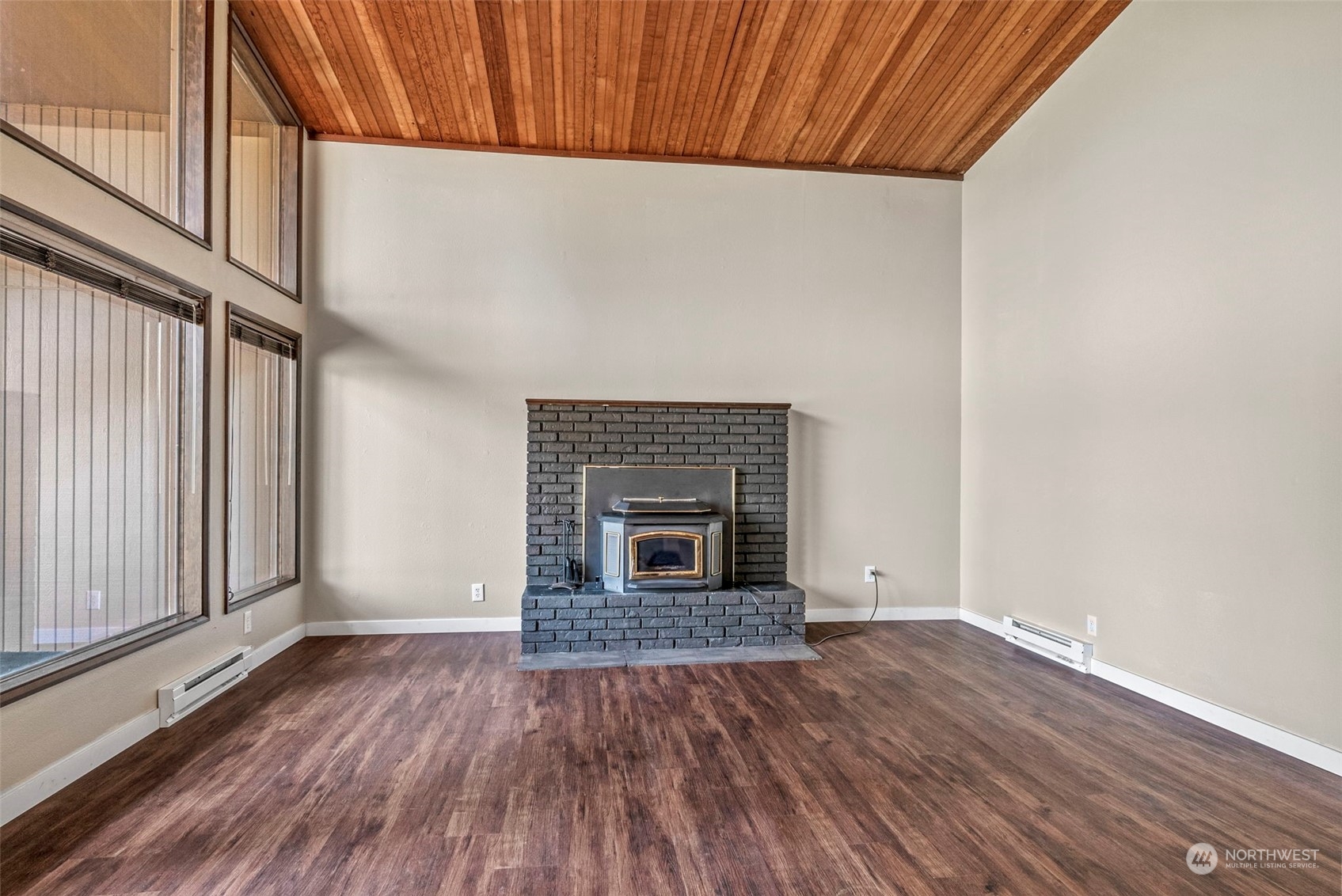 122 Fircrest Road Chehalis, WA 98532 - Photo 6 of 31 a view of an empty room with wooden floor fireplace and a window