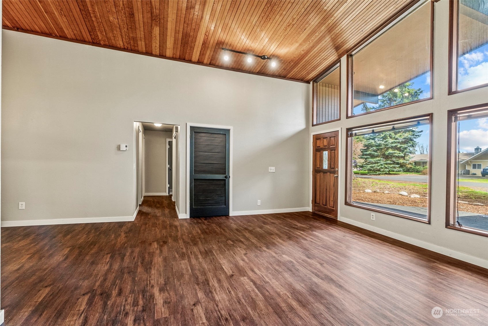 122 Fircrest Road Chehalis, WA 98532 - Photo 7 of 31 an empty room with wooden floor and windows