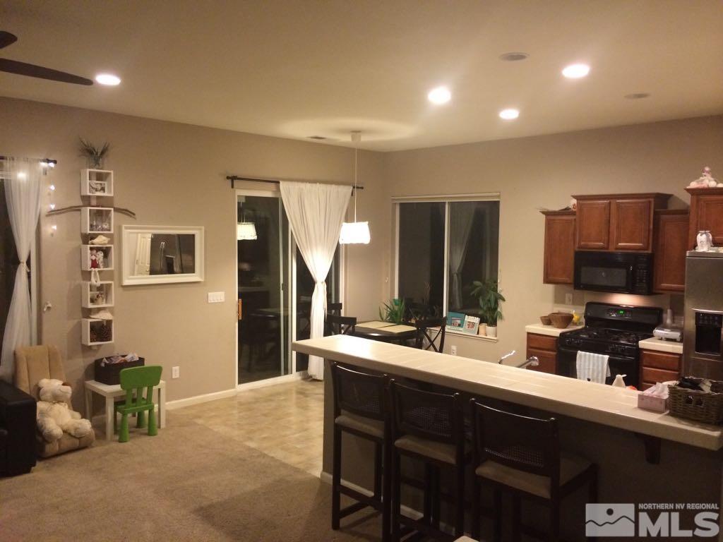1441 Hagar Road Reno, NV 89506 - Photo 11 of 18 a kitchen with a sink stove and refrigerator