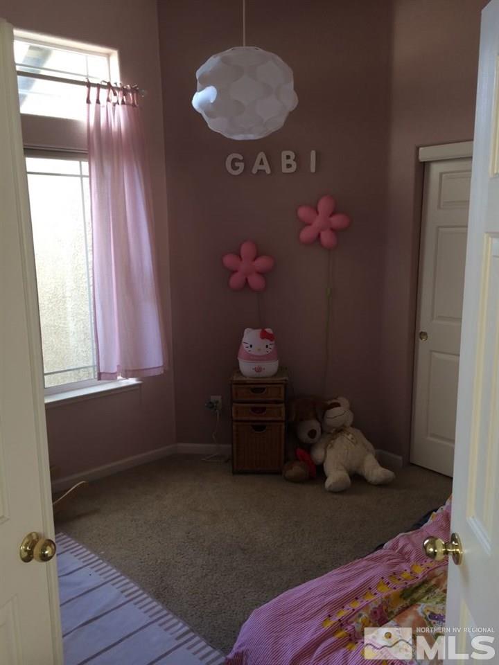 1441 Hagar Road Reno, NV 89506 - Photo 17 of 18 a room with toys and wooden floor