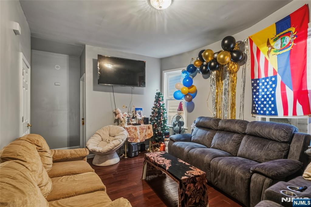 155 Myrtle Avenue Irvington, NJ 07111 - Photo 20 of 26 a living room with furniture and a flat screen tv