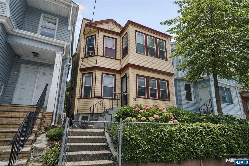 155 Myrtle Avenue Irvington, NJ 07111 - Photo 3 of 26 a front view of a house