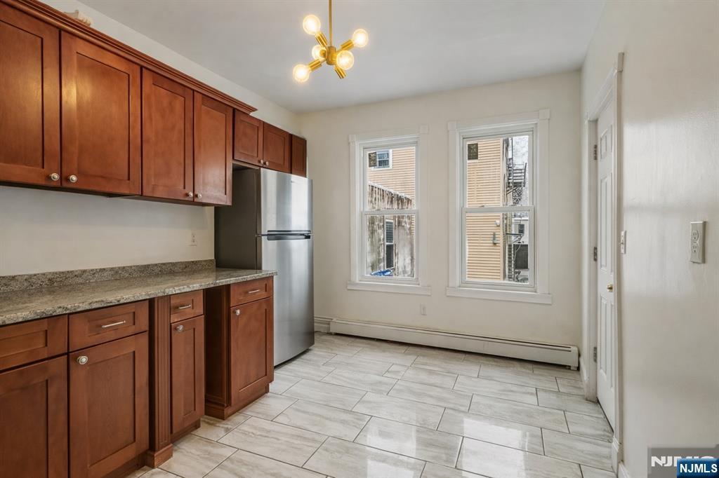 155 Myrtle Avenue Irvington, NJ 07111 - Photo 6 of 26 a large kitchen with cabinets