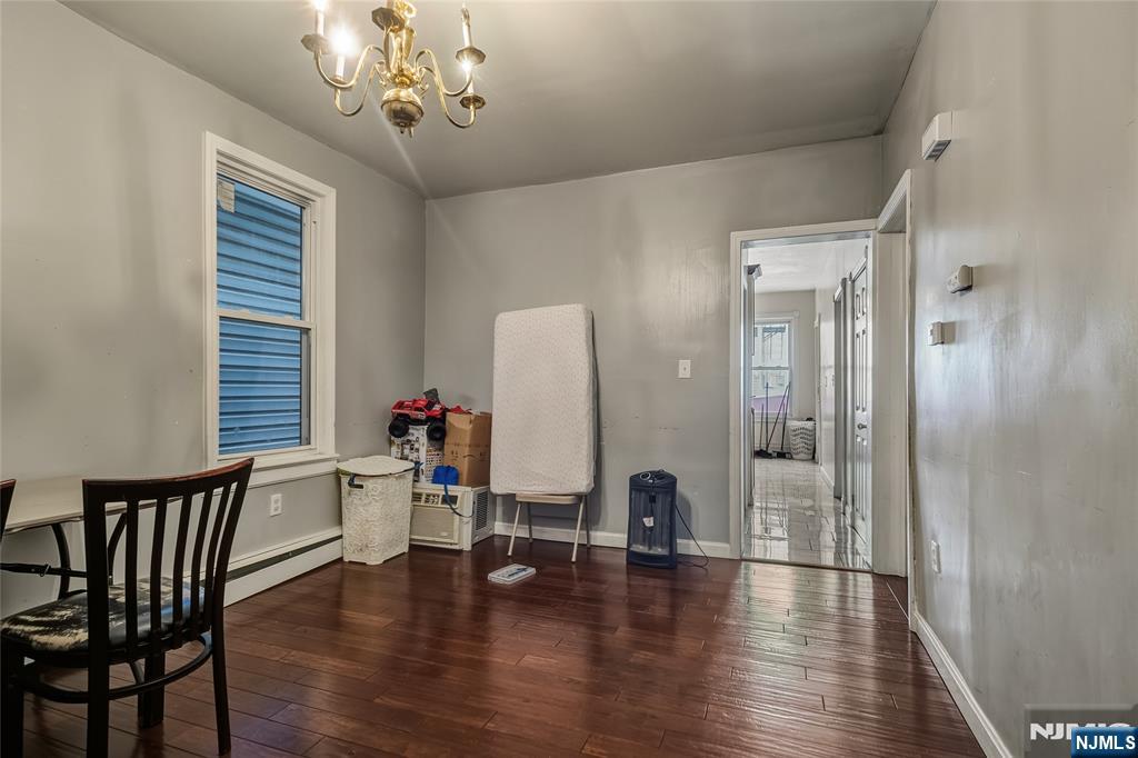 155 Myrtle Avenue Irvington, NJ 07111 - Photo 8 of 26 a view of a livingroom with furniture wooden floor and windows