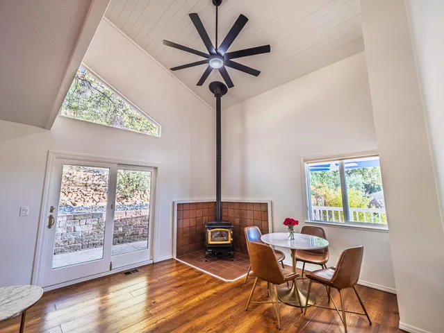 a living room with furniture and a floor to ceiling window