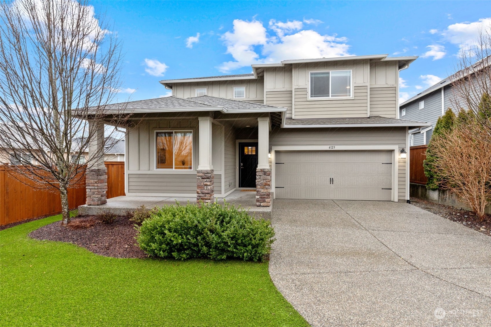 4123 175th Place Southeast Bothell, WA 98012 - Photo 1 of 40 a front view of a house with a garden and plants