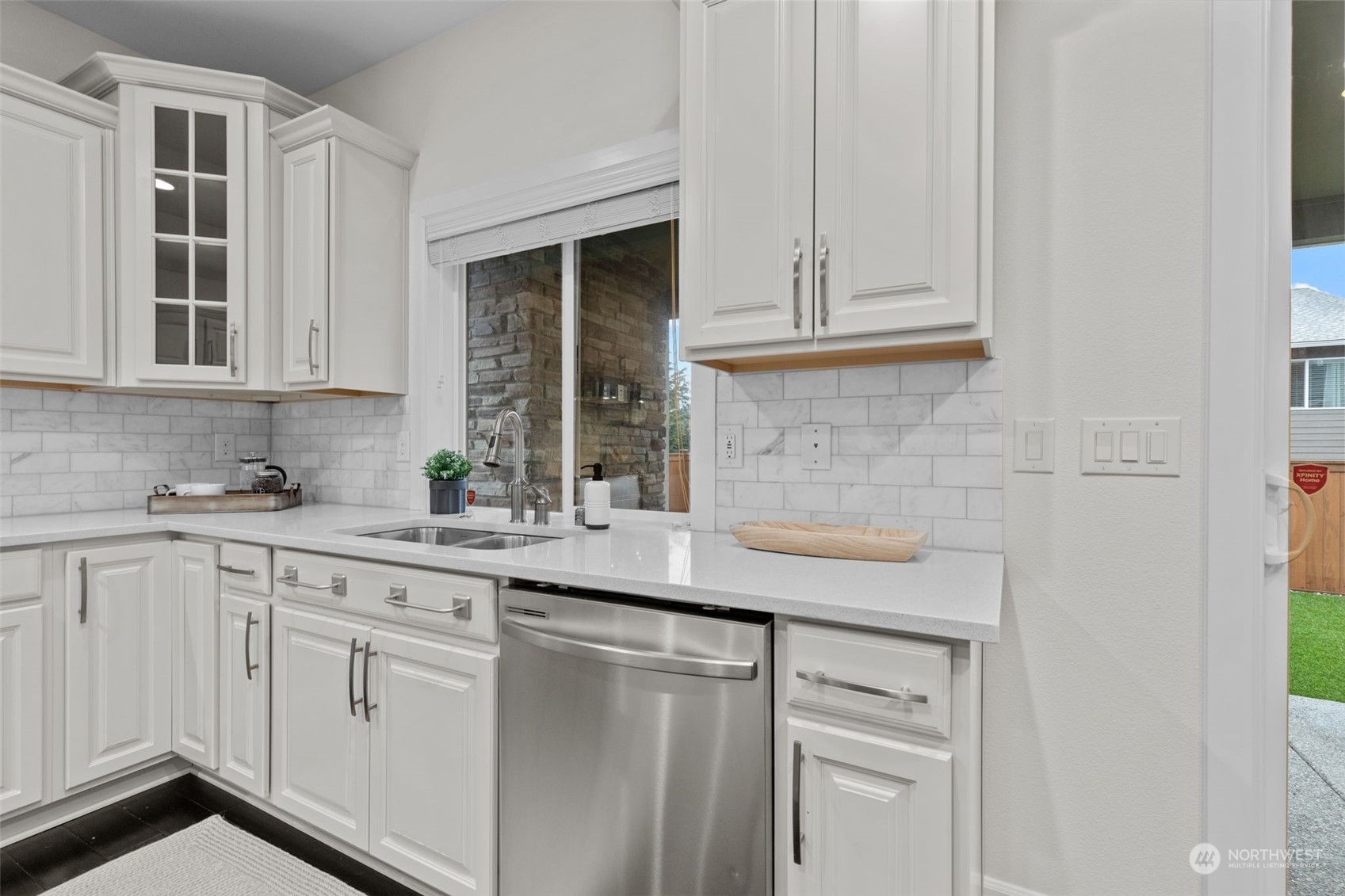 4123 175th Place Southeast Bothell, WA 98012 - Photo 12 of 40 a kitchen with white cabinets and a sink