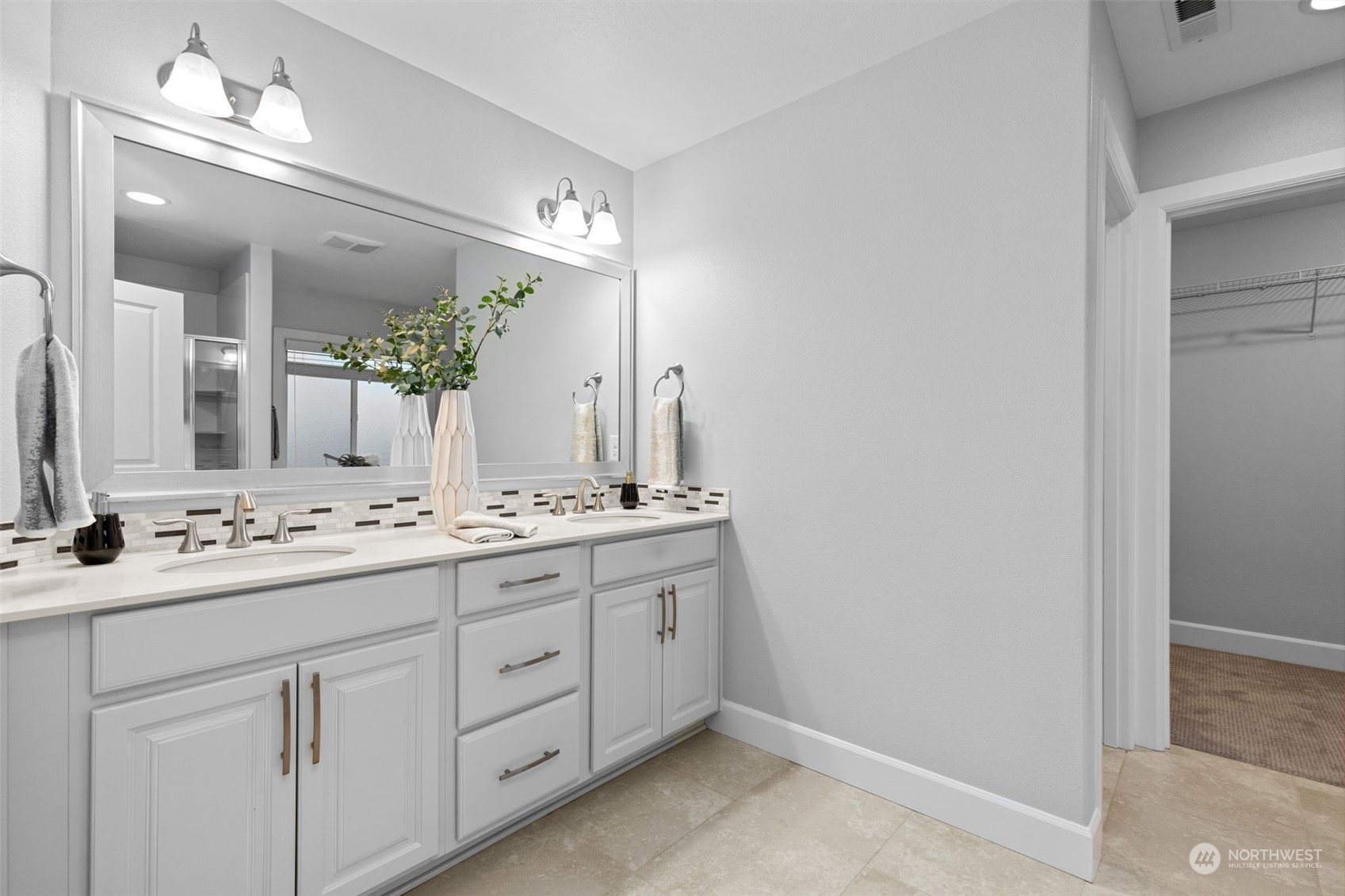 4123 175th Place Southeast Bothell, WA 98012 - Photo 30 of 40 a bathroom with a double vanity sink and a mirror