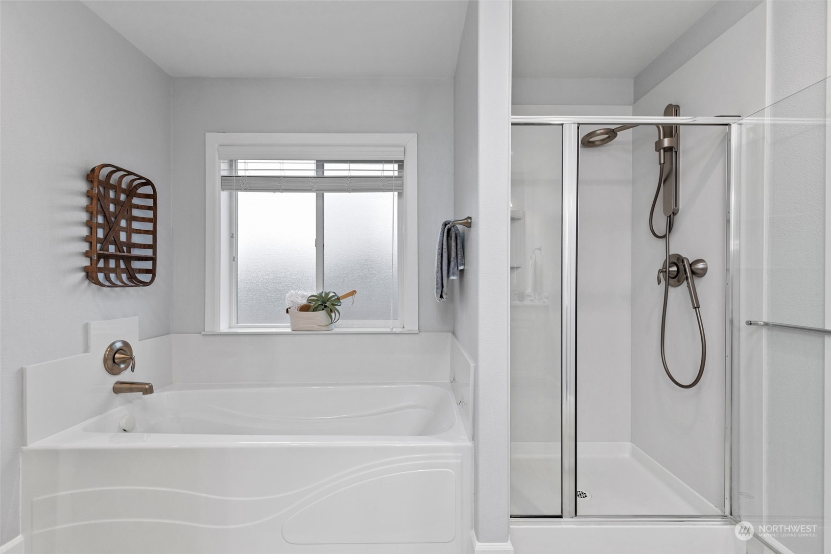 4123 175th Place Southeast Bothell, WA 98012 - Photo 31 of 40 a bathroom with a bathtub a shower and a window