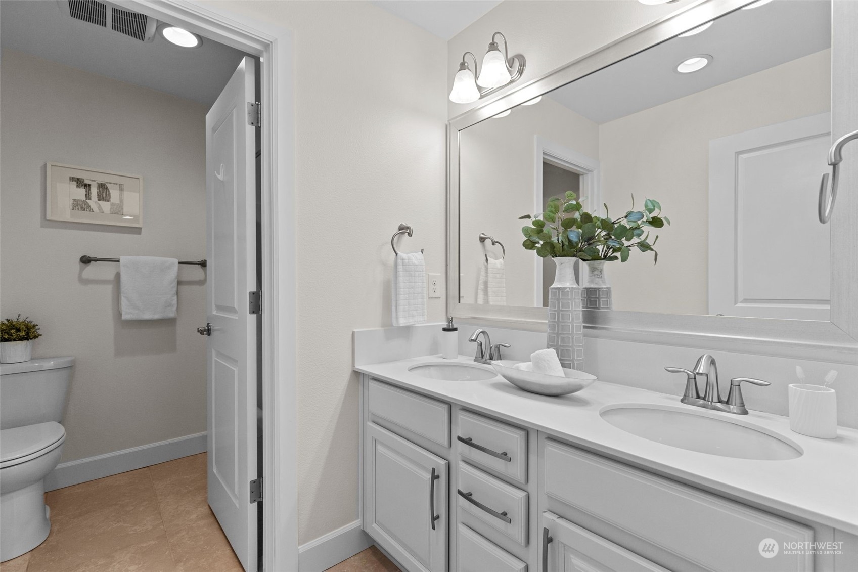 4123 175th Place Southeast Bothell, WA 98012 - Photo 36 of 40 a bathroom with a granite countertop sink a toilet and a mirror
