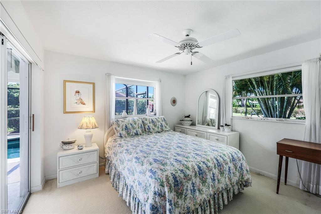 770 Anchor Rode Drive Naples, FL 34103 - Photo 19 of 26 The guest wing offers one bedroom with direct access to the screened lanai and pool