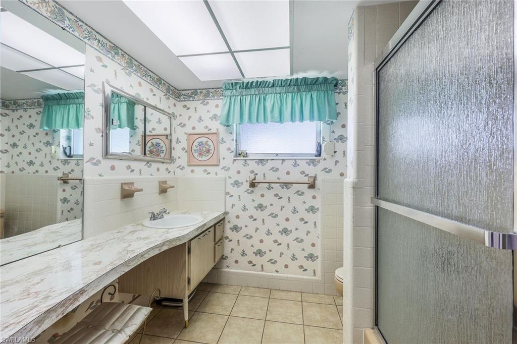 770 Anchor Rode Drive Naples, FL 34103 - Photo 20 of 26 The guest bathroom services the two guest rooms and also functions as the common bathroom
