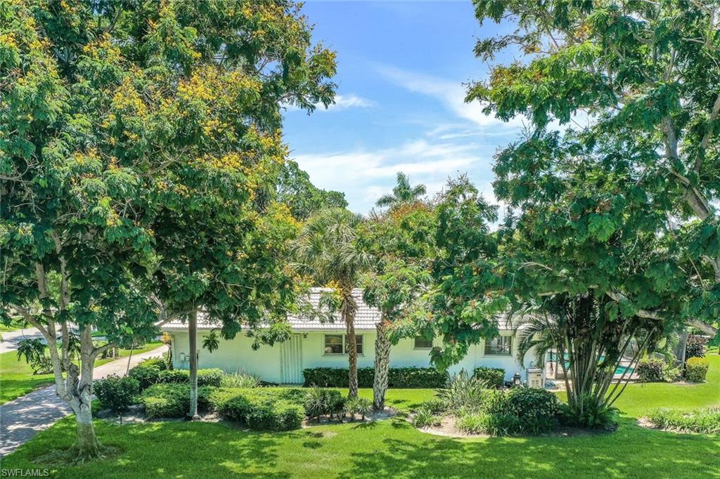 770 Anchor Rode Drive Naples, FL 34103 - Photo 8 of 26 Lush vegetation surrounds the property