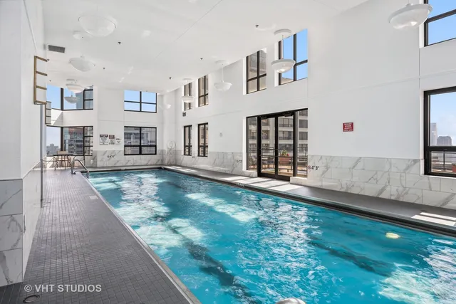a view of a living room and hall way with furniture
