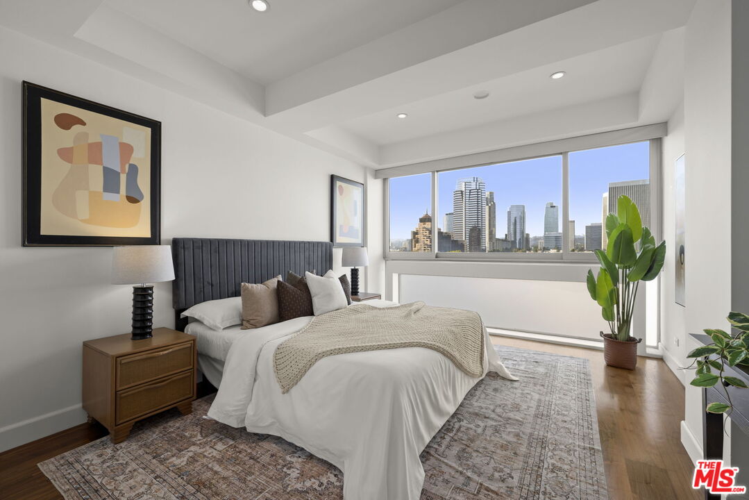2222 Avenue Of The Stars, Unit 1004 Los Angeles, CA 90067 - Photo 14 of 25 a living room with furniture and a large window