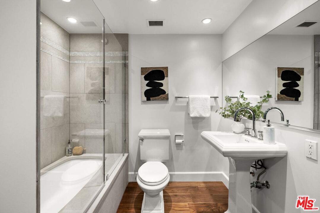 2222 Avenue Of The Stars, Unit 1004 Los Angeles, CA 90067 - Photo 16 of 25 a bathroom with a sink toilet and shower