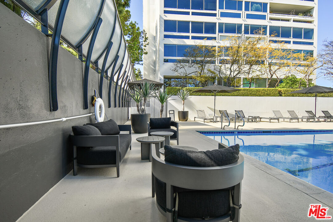 2222 Avenue Of The Stars, Unit 1004 Los Angeles, CA 90067 - Photo 21 of 25 a building outdoor space with patio furniture and potted plants