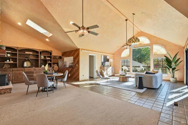 a bathroom with a granite countertop sink a mirror and a shower