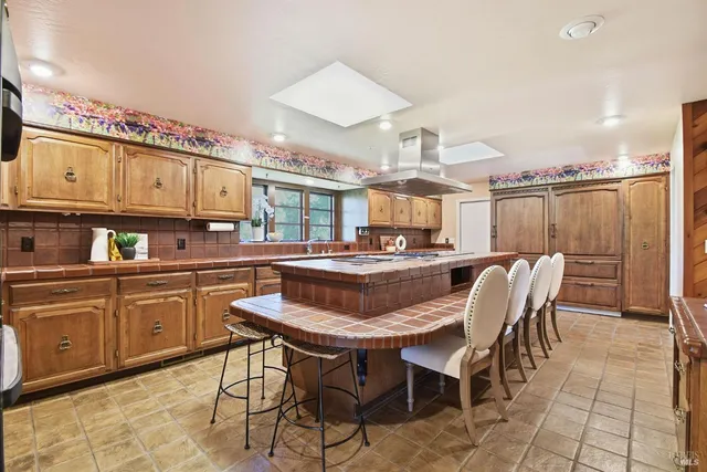 a bedroom with a bed lamp and a large window