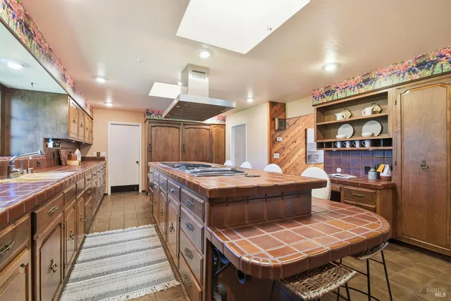 a bedroom with a bed and painting on the wall