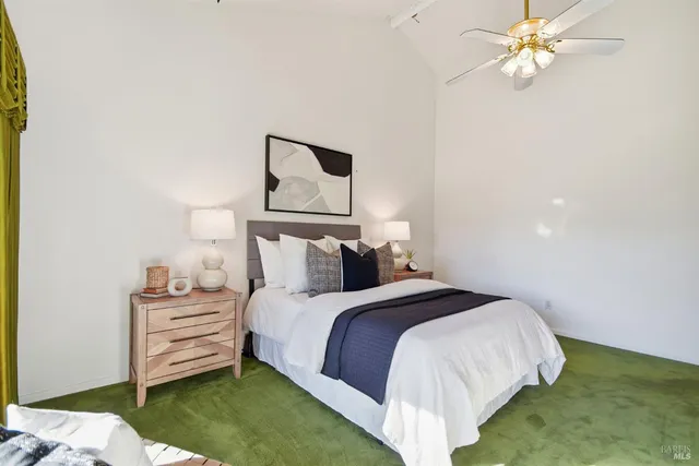 a view of a kitchen with a sink and a refrigerator