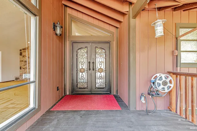 a living room with fireplace furniture and a potted plant