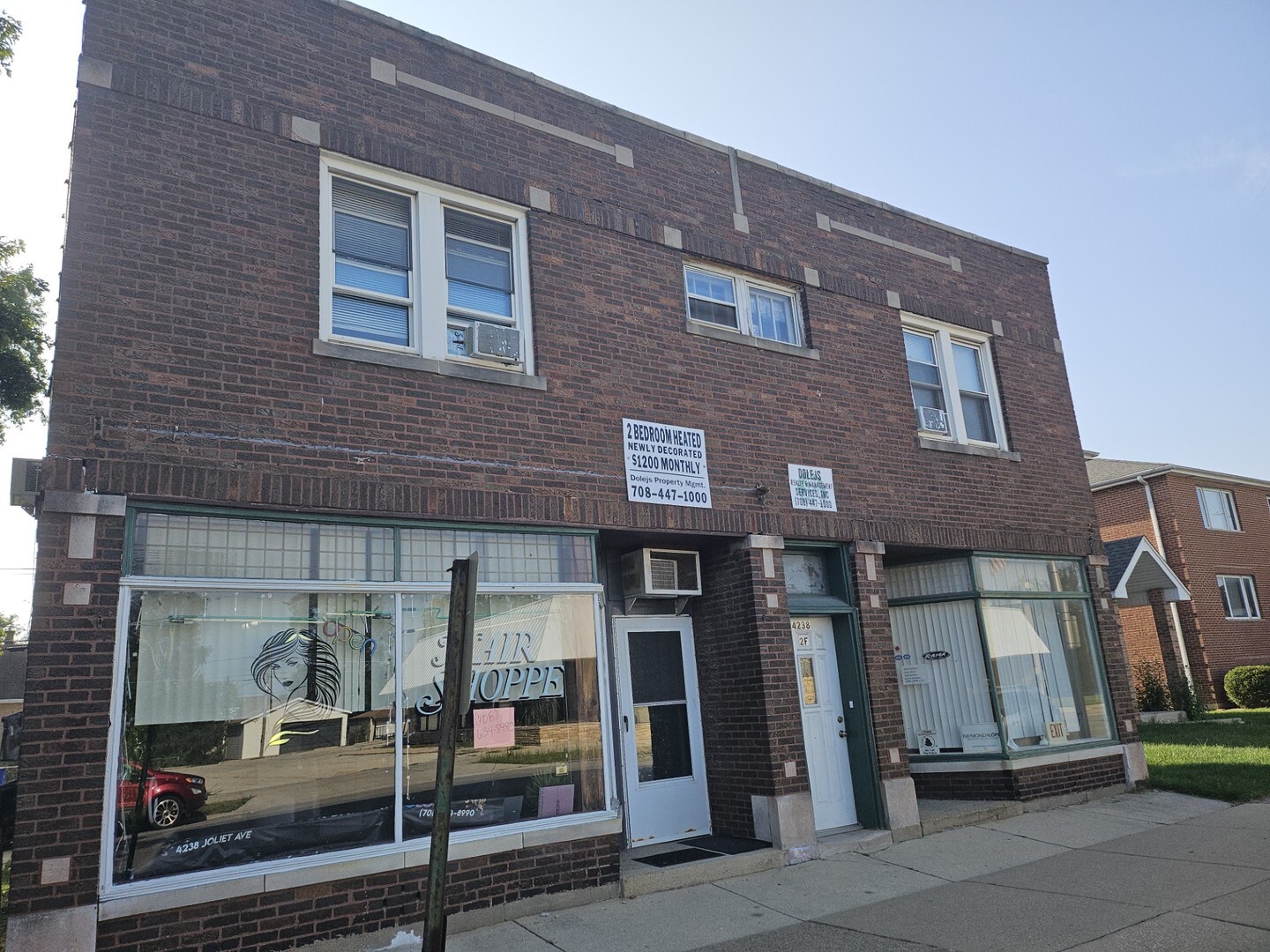 4238 Joliet Avenue, Unit 1R Lyons, IL 60534 - Photo 1 of 9 a front view of a house with glass windows