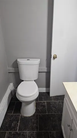 a bathroom with a toilet and a sink