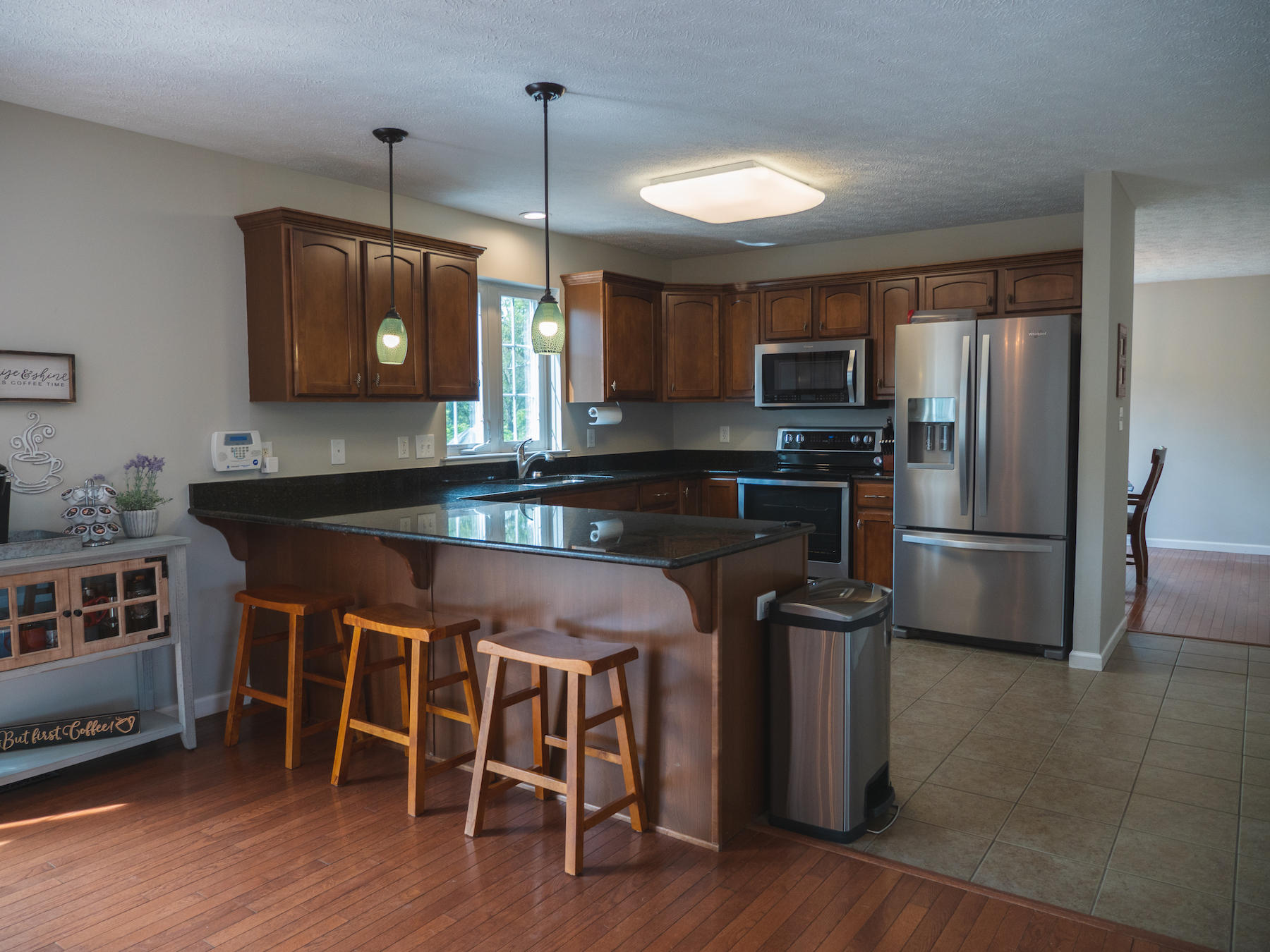 1124 Union Valley Road Riner, VA 24149 - Photo 2 of 67 a kitchen with stainless steel appliances granite countertop a stove a refrigerator a kitchen island a sink and a refrigerator