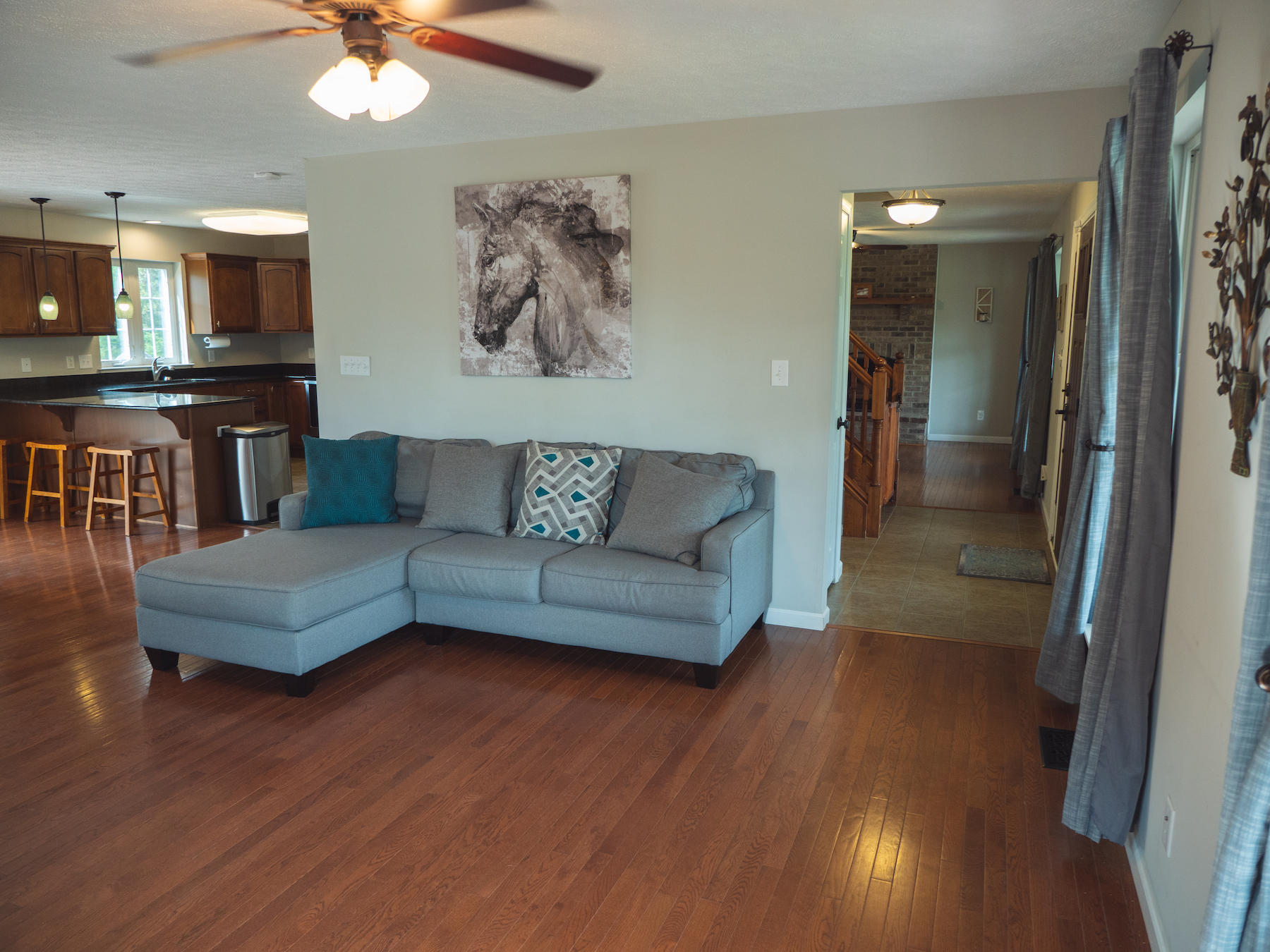 1124 Union Valley Road Riner, VA 24149 - Photo 13 of 67 a living room with furniture and a kitchen view