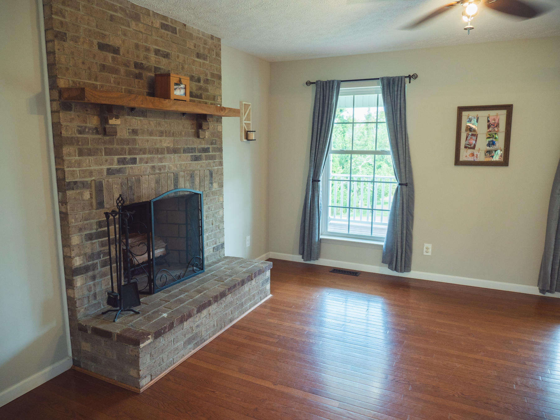 1124 Union Valley Road Riner, VA 24149 - Photo 15 of 67 a living room with wooden floor and a fireplace