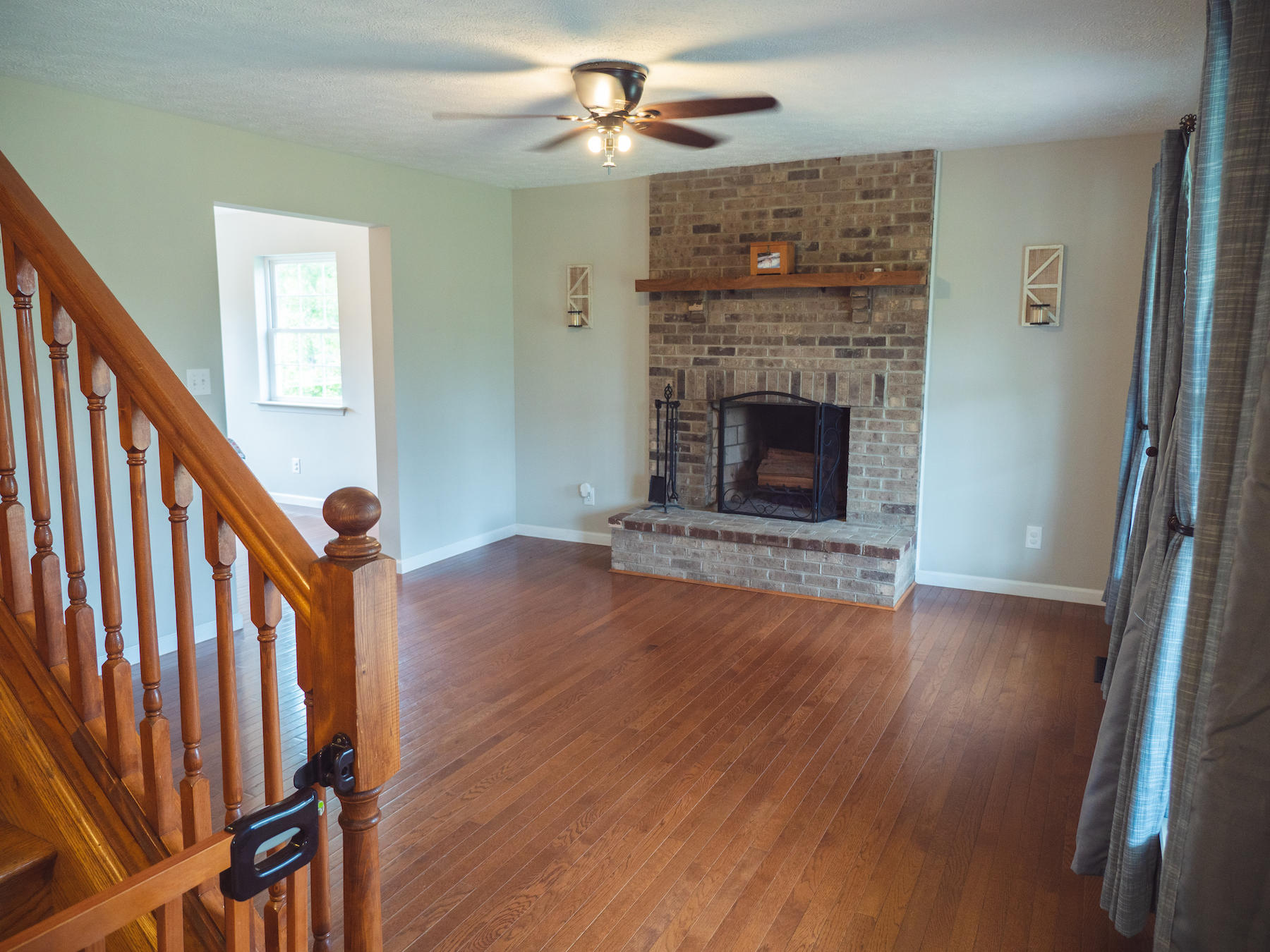 1124 Union Valley Road Riner, VA 24149 - Photo 17 of 67 a view of a livingroom with wooden floor and a fireplace