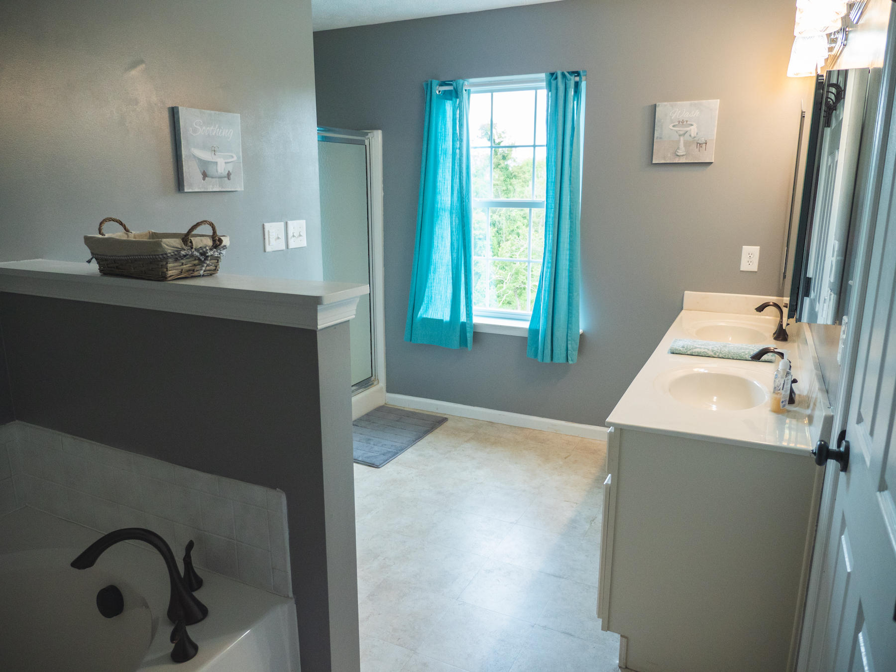 1124 Union Valley Road Riner, VA 24149 - Photo 22 of 67 a bathroom with a tub sink and mirror