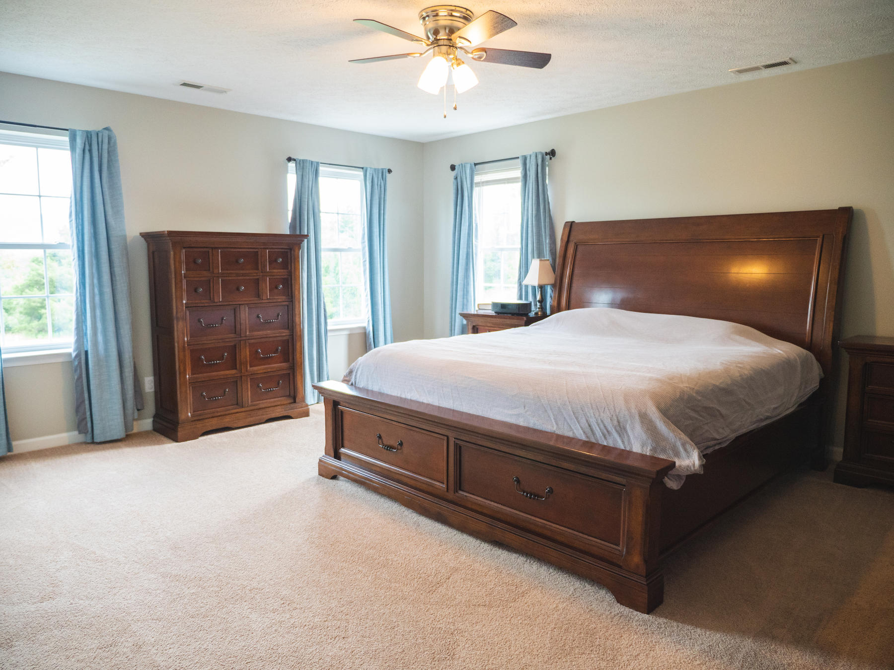 1124 Union Valley Road Riner, VA 24149 - Photo 27 of 67 a bedroom with a bed and a chandelier