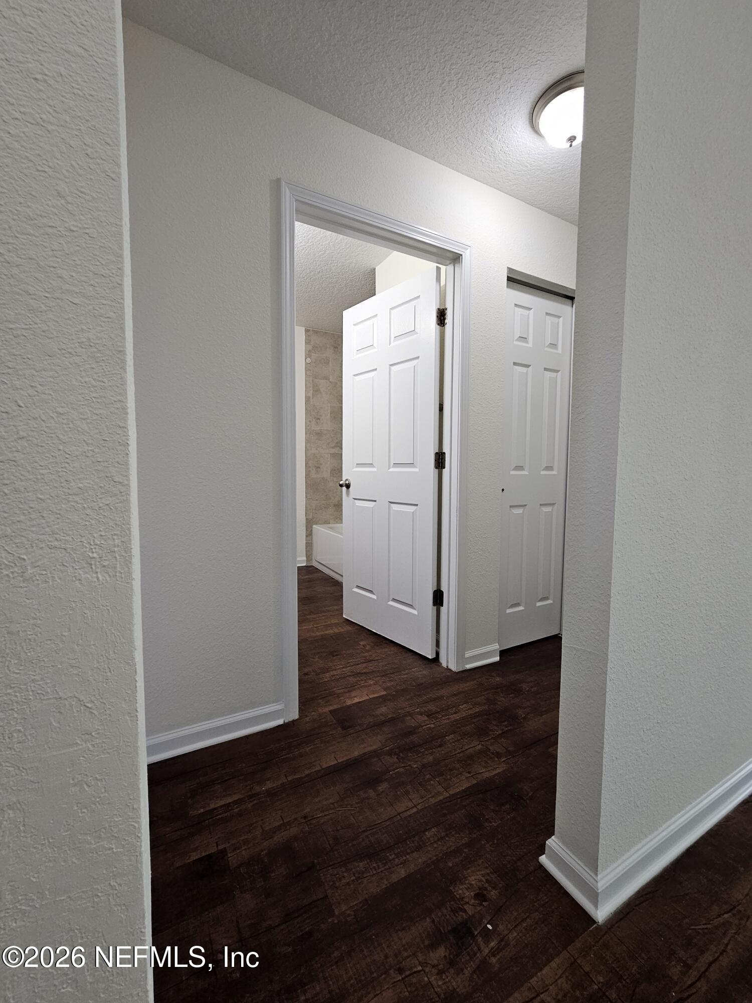 9314 Java Fern Court Jacksonville, FL 32219 - Photo 23 of 32 hallway to 2nd bath, bdrm 3 & 4