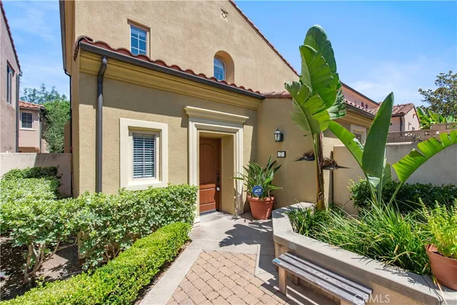 a view of a house with a flower garden