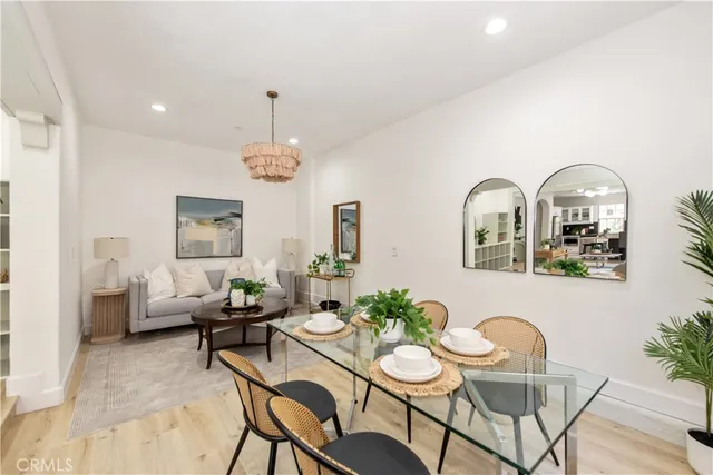 a view of a livingroom with furniture window and wooden floor
