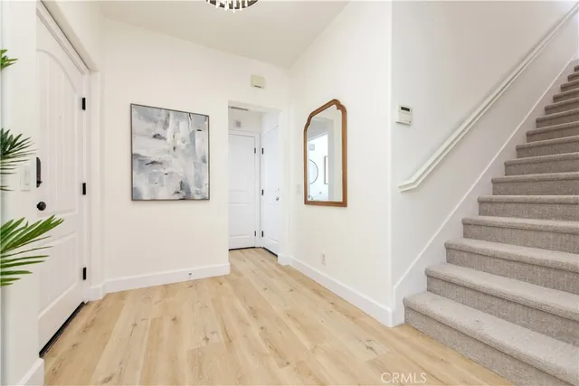 a view of an entryway with wooden floor