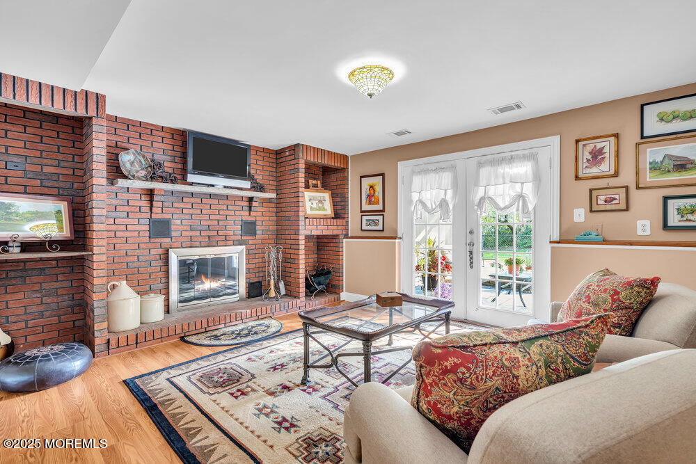 460 Alexander Avenue Howell, NJ 07731 - Photo 3 of 14 a living room with furniture windows and a fireplace