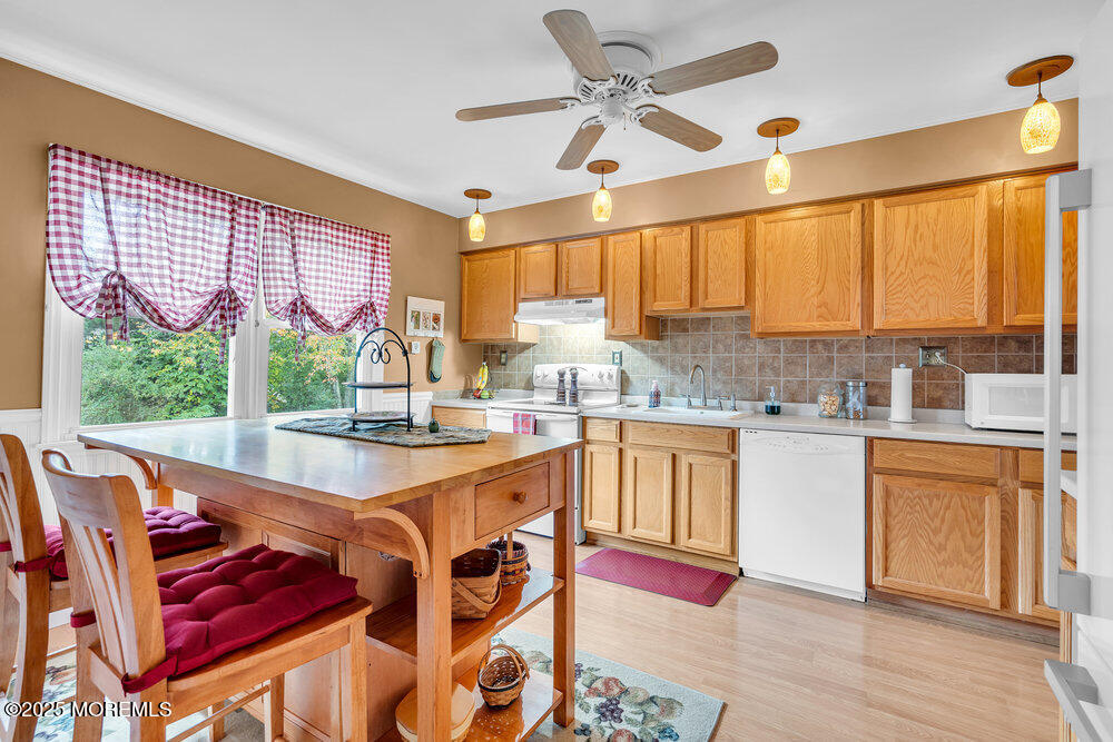 460 Alexander Avenue Howell, NJ 07731 - Photo 4 of 14 a large white kitchen with a large window