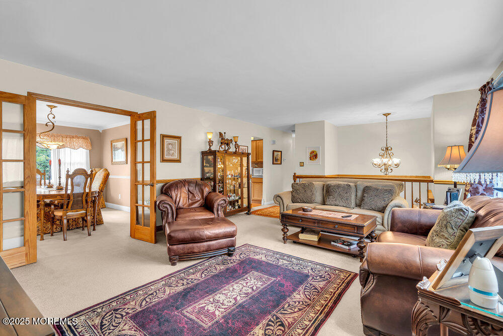 460 Alexander Avenue Howell, NJ 07731 - Photo 6 of 14 a living room with furniture a rug and a table