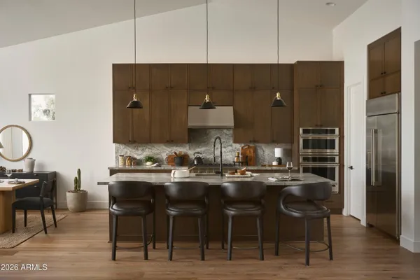 a kitchen with stainless steel appliances a sink and cabinets