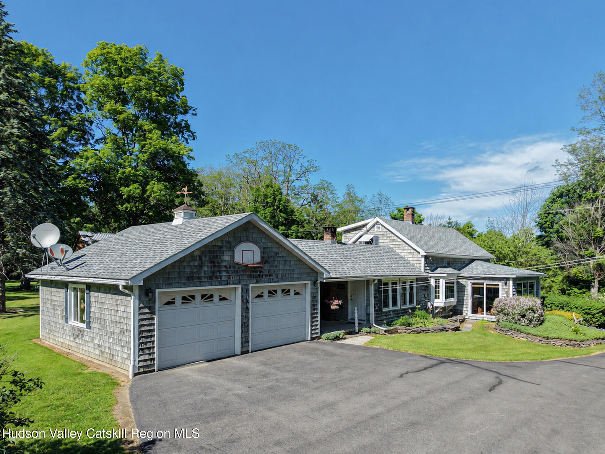 221 Camp Medusa Road Rensselaerville, NY 12120 - Photo 1 of 57 a front view of a house with garden