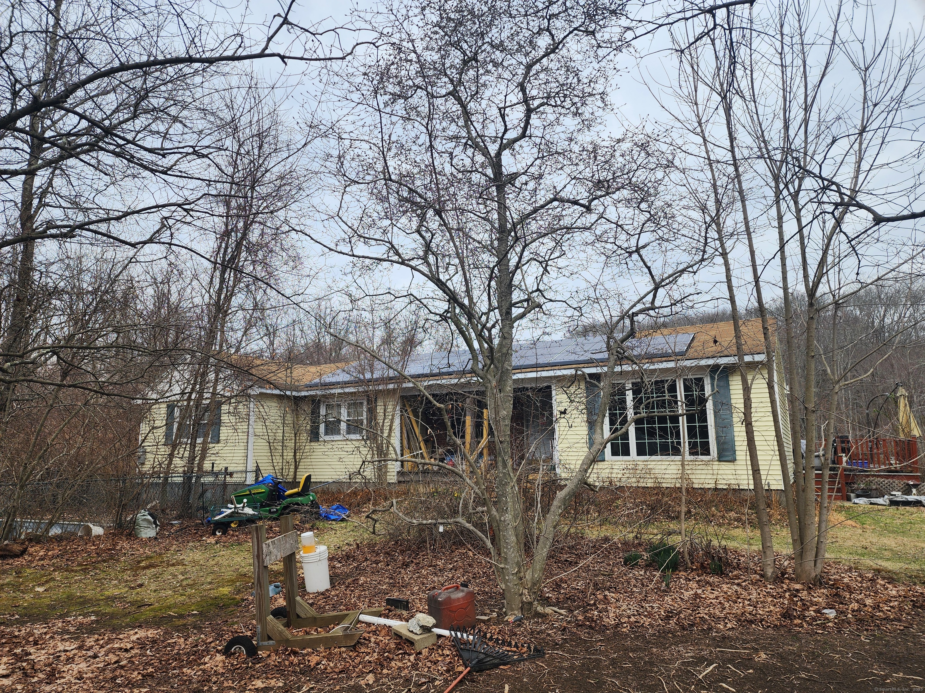 576 Voluntown Road Griswold, CT 06351 - Photo 2 of 15 a front view of a house with a yard