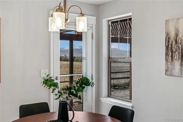 a view of a livingroom with furniture and front door