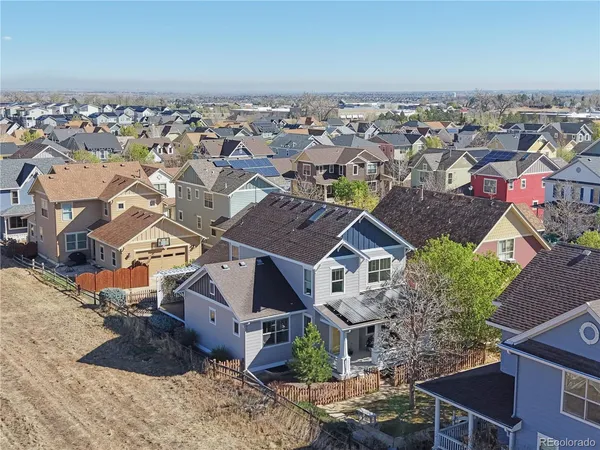an aerial view of residential houses with outdoor space