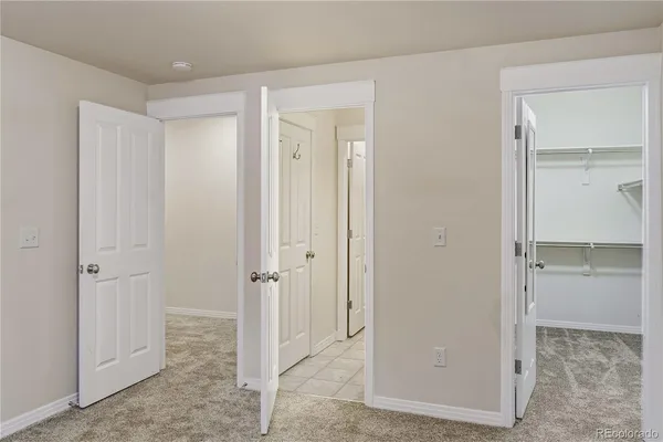 a view of a bathroom with a glass door shower